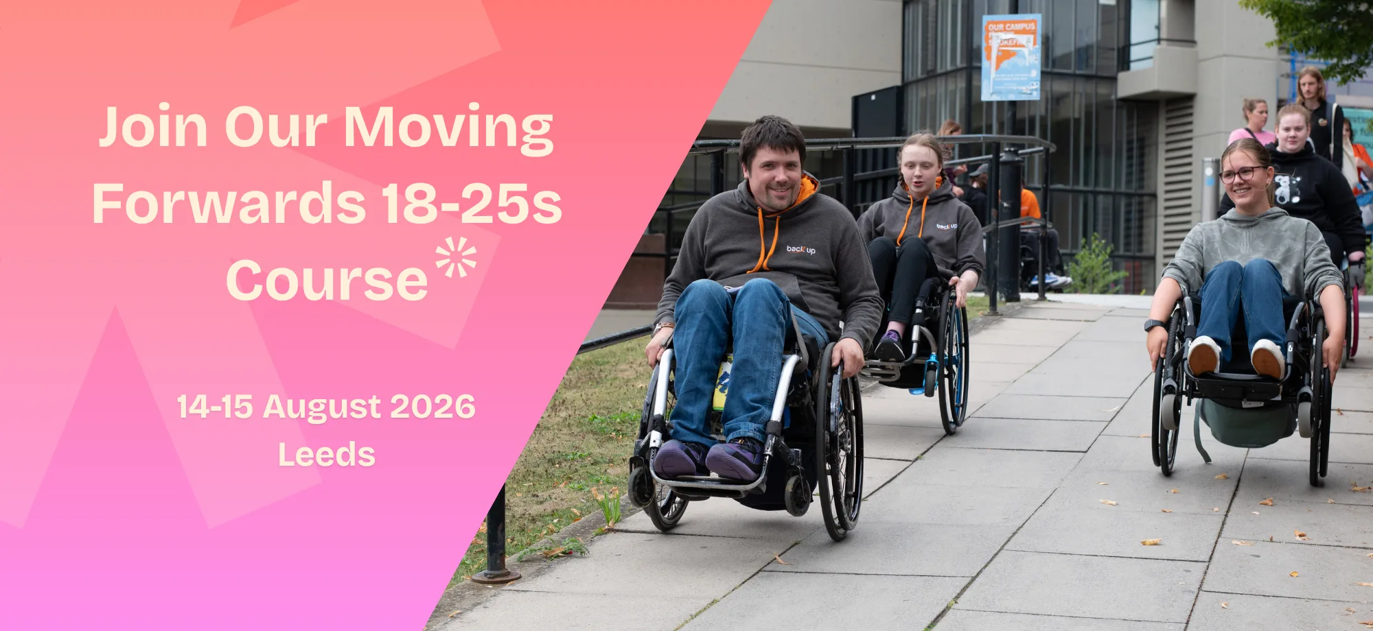 A group of wheelchair users taking part in an outdoor course